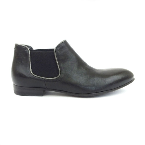 A soft black leather ankle boot with silver accents