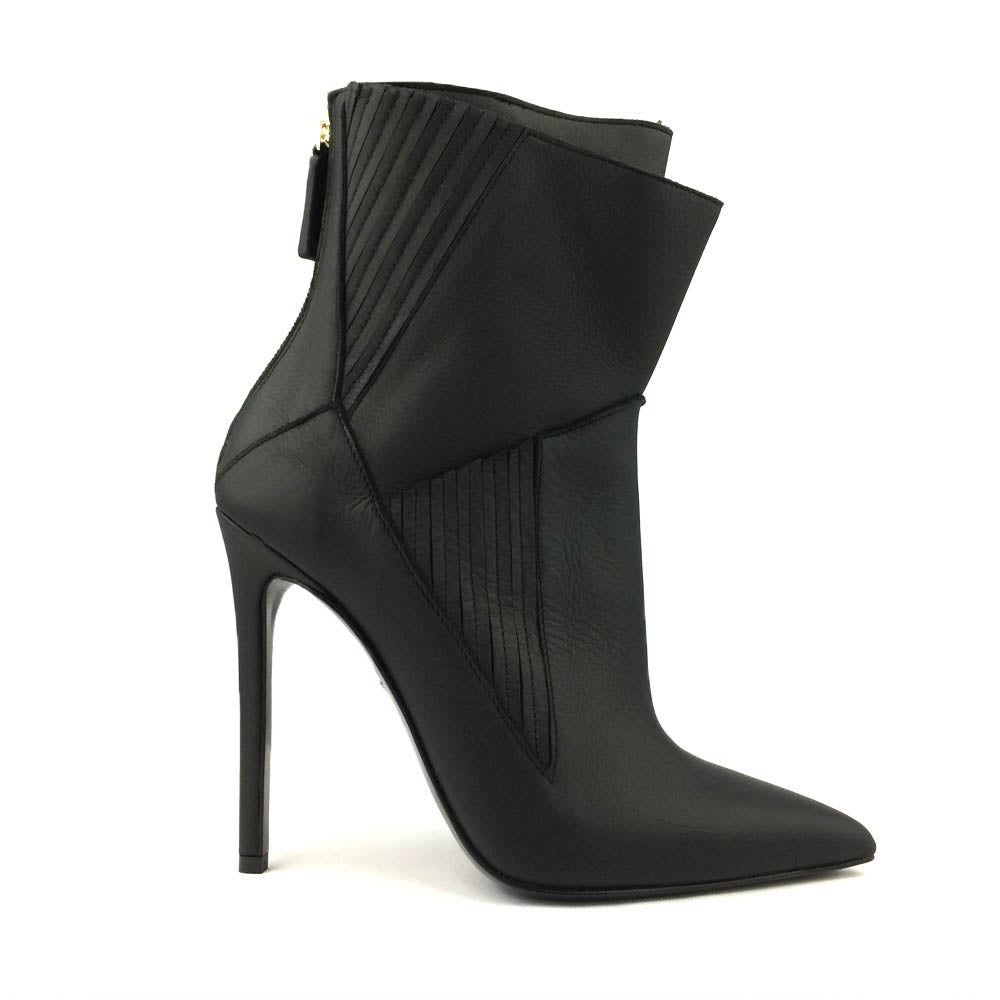 A black leather high heel ankle boot with a rear zipper and distinctive architectural design.