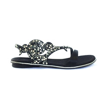 A black flat sandal with a decorative satin lining and sparkling elements on the straps, handmade in Italy.