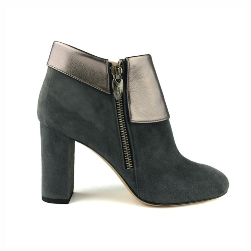 A suede ankle boot with a metallic finish and zipper on the side, featuring a chunky heel.